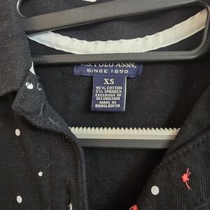 U.S. Polo Assn. Black Polo with White Polka Dots and Red Logo